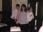 Simon, Carol and Chloe cutting the Christening Cake on 20 April 2003